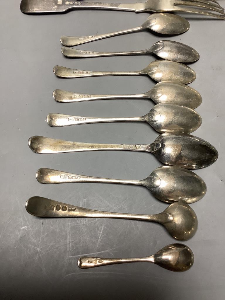 A small collection of silver fiddle pattern flatware, two pairs of sugar tongs and sundry silver coffee and condiment spoons, Georgian and later, approximately 18oz